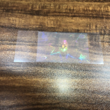 Pelekat holografik lutsinar